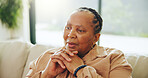 Home, senior black woman and thinking with memory, remember past or contemplation on sofa. Thoughts, reflection and serious elderly person with nostalgia, decision and retirement in living room