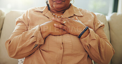 Buy stock photo Sick, hands and woman in home with chest pain, cardiac arrest or breathing problem in living room. Illness, asthma and person on sofa with heart attack symptoms, angina or cardiovascular emergency.