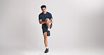 Exercise, stretching and portrait of man on studio space for start of training or workout routine. Fitness, legs and warm up with athlete on gray background mockup for challenge or sports performance