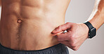 Fitness, pinch abdomen or hand with body fat check, skin fold test or measure stomach slimming for progress. Results evaluation, track diet or man with weight loss for health, monitor size or studio
