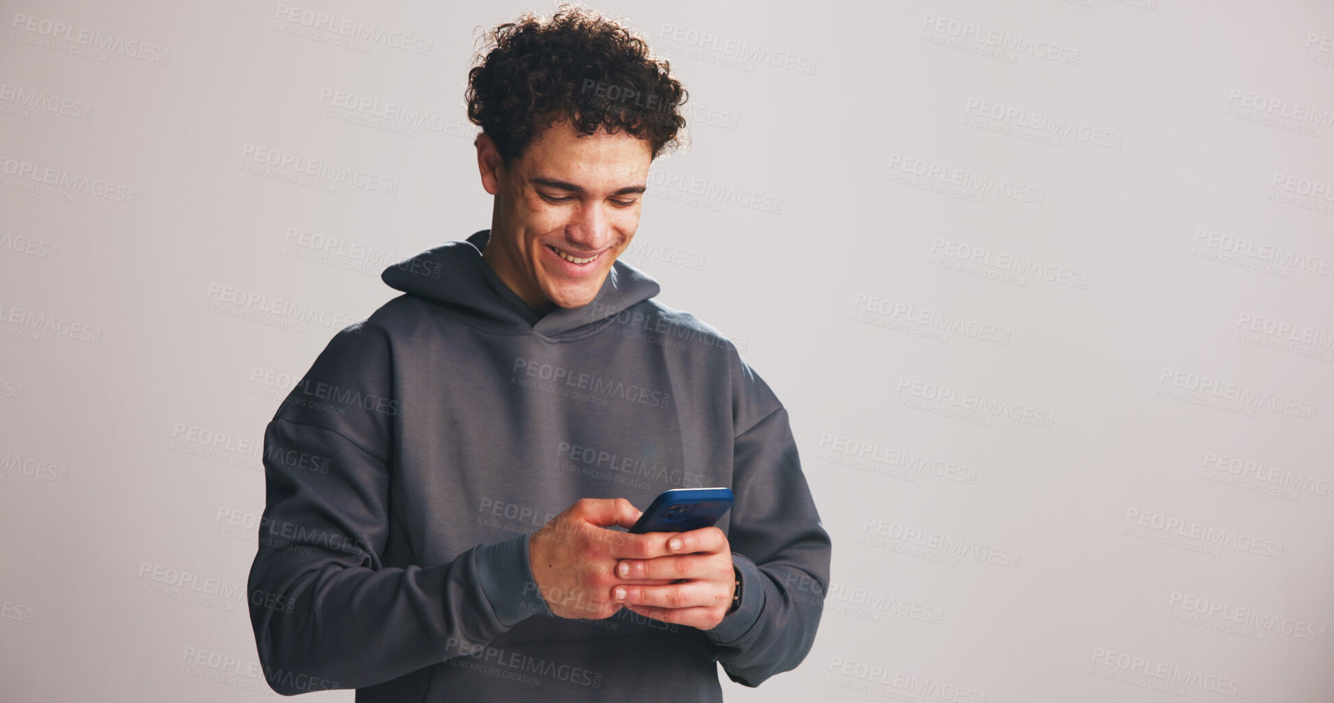 Buy stock photo Phone, happy and man in studio with fitness research, mobile app or workout plan for training. Technology, mockup space and male athlete with cellphone for sports communication by white background.
