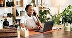 Phone call, smile or black woman in office with laptop, client chat or research on sustainable material. Happy, review or eco consultant in agency with tech, feedback or negotiation on green product.