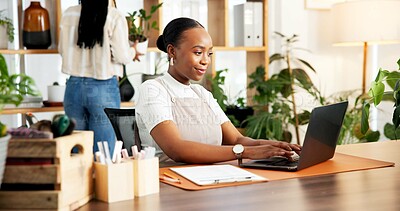 Buy stock photo Black woman, plant shop and typing on laptop for small business, inventory or online order. Happy florist, computer and person in office for stock, sales info or floral arrangement in startup nursery