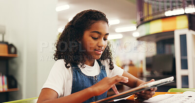 Buy stock photo Education, scrolling or child in library with tablet, elearning or online guide for academic development. Digital, browse and girl at table with tech, homework app or guidance in remote learning.