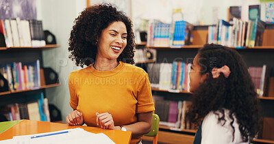 Buy stock photo Happy, child or teacher with lesson in library for tutoring, learning support or test assessment. Laugh, tutor or student with conversation at school for exam preparation, literacy discussion or chat