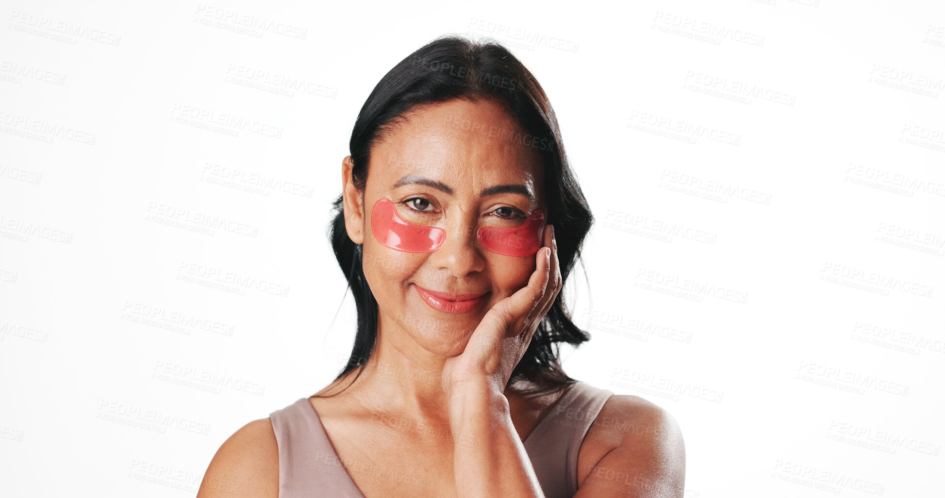 Buy stock photo Eye mask, portrait and woman in studio for dark circles, circulation and skincare. Mockup space, dermatology and mature person with beauty pads for wellness, hydration and health on white background