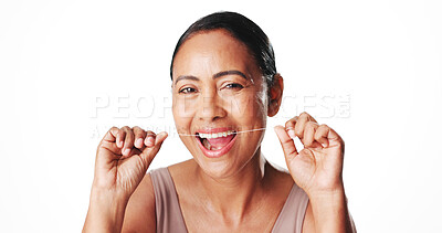 Buy stock photo Oral hygiene, woman and teeth floss in studio for plaque removal, healthy gums or fresh breath. Mockup space, mature person and portrait with dental string for grooming routine on white background
