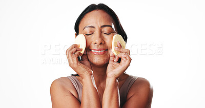 Buy stock photo Woman, sponge and skincare with smile in studio, beauty product and mockup space on white background. Mature person, pad and happy with dermatology, cosmetics and self care routine for anti aging