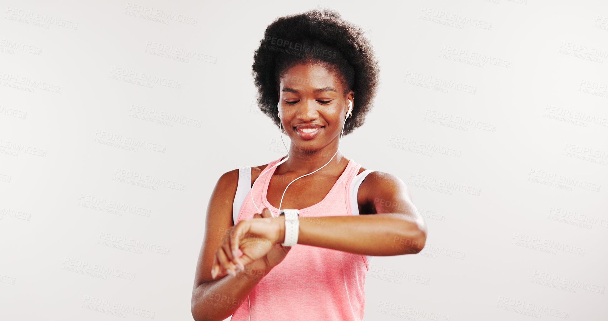 Buy stock photo Black woman, fitness and smart watch in studio, happy and earphones with mockup space on white background. African person, smile and listen to music with app, timer and iot with exercise routine