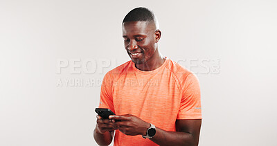 Buy stock photo Black man, phone and happy in studio with fitness, notification and mockup space on white background. African person, smile and smartphone with mobile app for training, stats and scroll for results