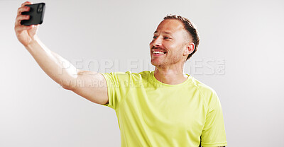 Buy stock photo Selfie, happy and fitness with man in studio for social media gym membership promotion and memory. Profile picture, personal trainer post and photography with male person on white background