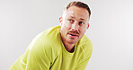 Tired, exercise and man in studio rest for recovery from fitness, training and workout. Mockup space, athlete and person with sweat, fatigue and thinking for wellness or health on white background