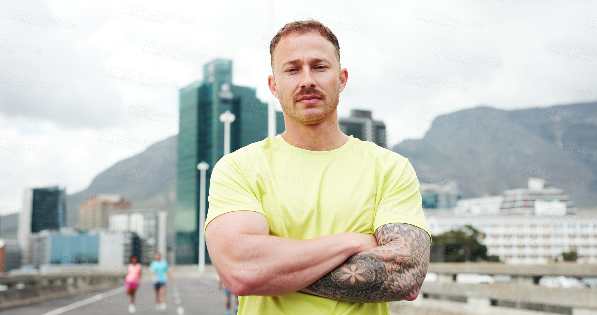 Buy stock photo Confident, fitness and portrait of man in city with crossed arms for exercise, training and workout. Runner, athlete and person in urban town for marathon, challenge and running for health outdoor