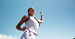 Happy woman, fitness and winning with blue sky for race, sprint challenge or marathon in city. Active, female person or runner with smile for victory, achievement or accomplishment on mockup space