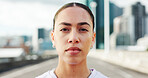 Confident, fitness and portrait of woman in city with determination for exercise, training and workout. Runner, athlete and person in urban town for marathon, challenge and running for health outdoor