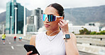 Woman, runner and phone with earphones in city, bridge and break with audio subscription for training. Person, smartphone and sunglass with mobile app, listen and streaming music with fitness routine