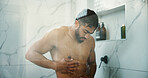 Water, morning and man in shower in bathroom for germs, dirt or bacteria removal with body care. Grooming, dermatology and male person washing skin for health, wellness or hygiene routine in home.