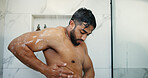 Man, shower and wash body in bathroom, morning and water drops with soap for dermatology in home. Person, shirtless and cleaning for bacteria with grooming, healthy skin or foam for hygiene at house