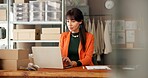 Face, Ecommerce and laptop with business woman in warehouse for shipping, fashion retail and about us. Designer startup, clothing entrepreneur and supply chain with person in factory for distribution