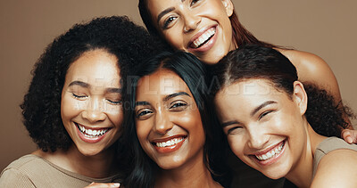 Buy stock photo Women, smile and diversity in studio for beauty, solidarity and bonding together with hug or unity. Friends, support and portrait on brown background for love, community or natural dermatology