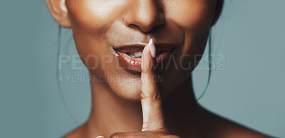Buy stock photo Beauty, hand gesture and hush with mouth of woman in studio for cosmetics or dermatology secrets. Aesthetic, finger on lips and skincare with model isolated on gray background for gossip or privacy