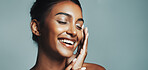Smile, woman and laughing for skincare in studio with beauty, healthy skin and natural shine. Space, female person and cosmetics for facial glow, collagen treatment and dermatology on gray background