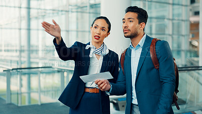 Buy stock photo People, gate agent and direction with traveler, boarding pass or ticket for assistance in airport. Man, woman or attendant helping customer with instruction for travel, departure or flight service
