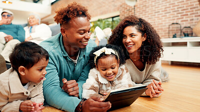 Buy stock photo Parents, children and tablet on floor, happy and bonding with care, love and online game in family house. People, mother and father with kids, tech and application for learning in living room at home