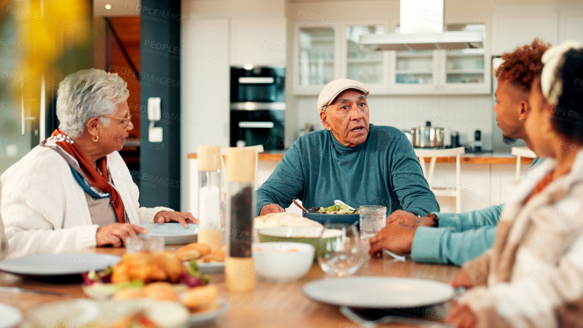 Buy stock photo Family dinner, senior man and talking in home for social gathering, holiday celebration or support. Love, people and old person with lunch party at dining table for festive reunion, bonding and chat