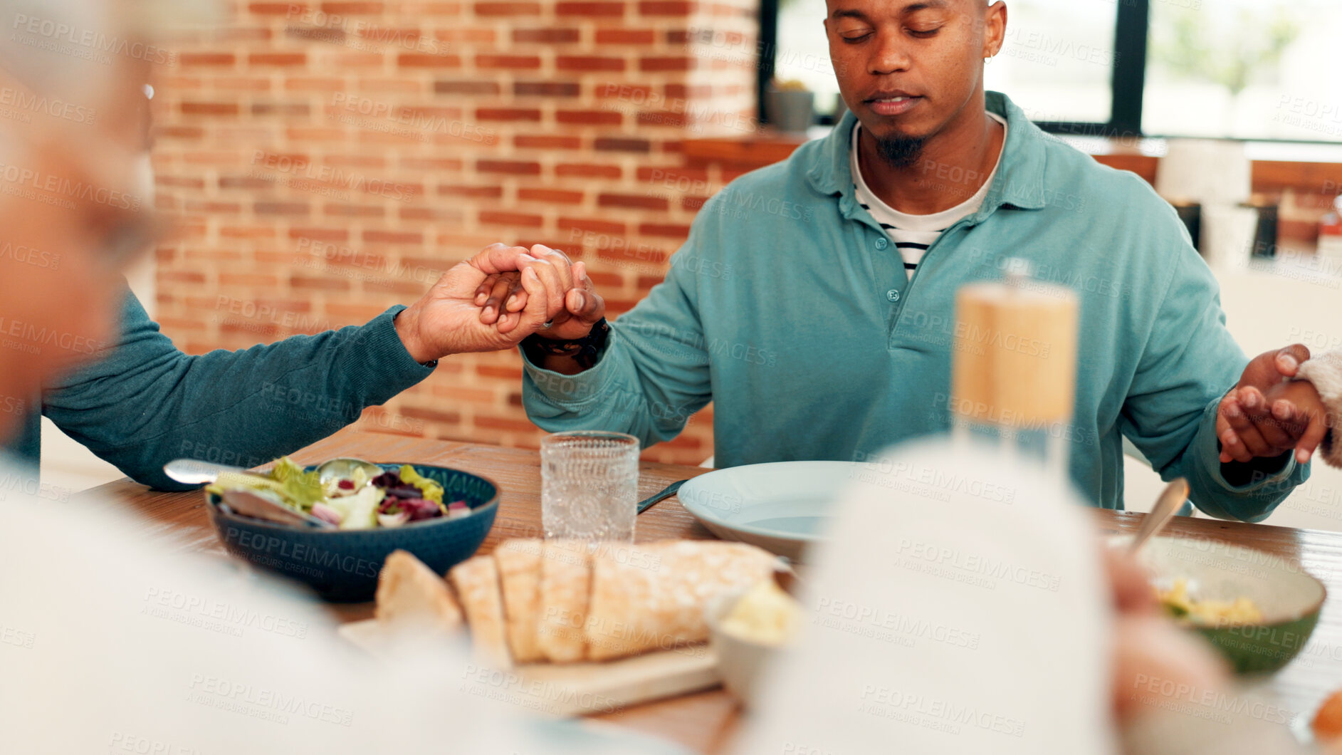 Buy stock photo Family, dining or holding hands with praying for food, faith or thanksgiving dinner together in home. Man, grace and gathering with connection for god worship, gratitude or thankful for meal in house