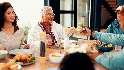Buy stock photo Happy family, food and passing with meal for dining, bonding or eating together in home. Grandparents, parents and table with feast, serving or sharing for lunch, hospitality or gathering in house