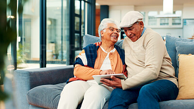 Buy stock photo Sofa, home and senior couple on tablet for online streaming, internet subscription and bonding. Retirement, marriage and mature man and woman on digital tech for videos, watching movie and relax