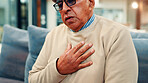 Senior man, chest pain and sofa with heart attack for cardiac arrest, illness or disease in home. Elderly, male person or hypertension with sore cough, respiratory infection or high blood pressure