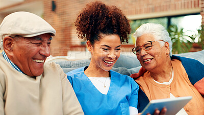 Buy stock photo Happy, tablet and nurse with old couple in home for talking, conversation and online website. Retirement, assisted living and caregiver, man and woman on tech for connection, social media and bonding