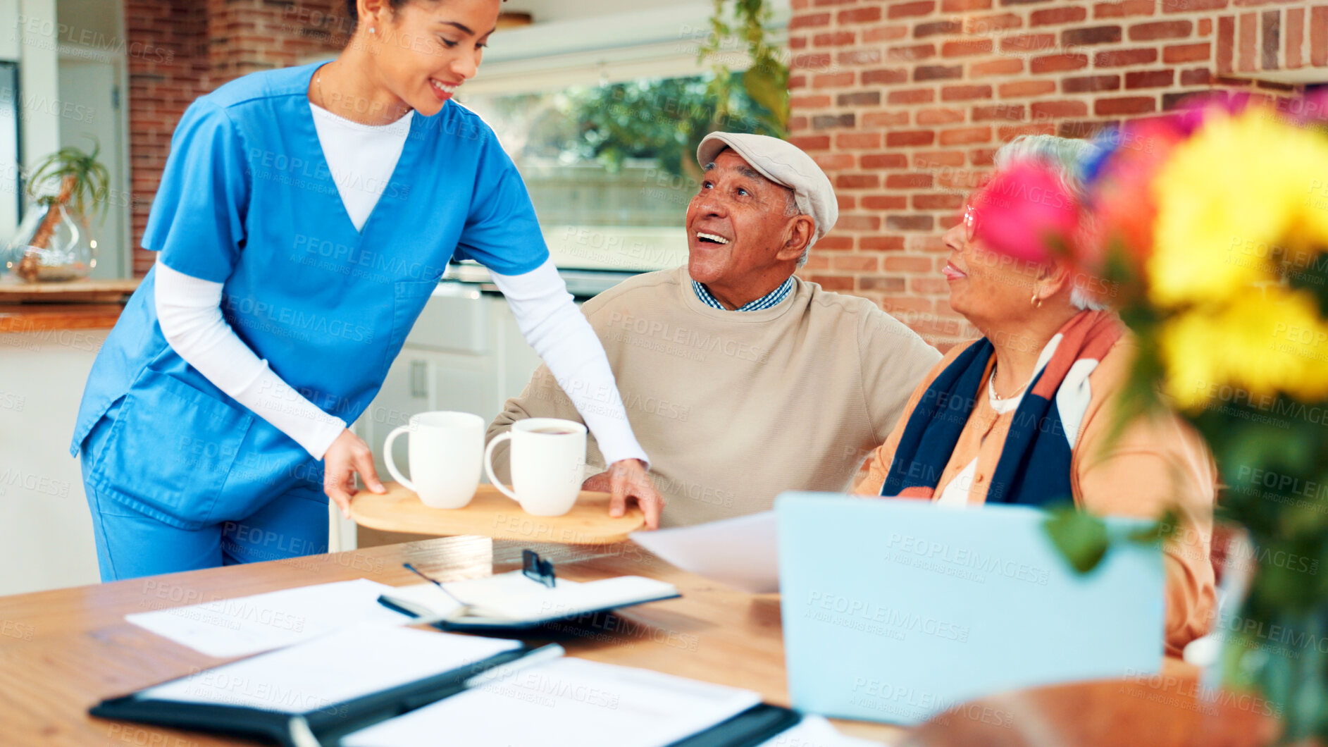 Buy stock photo Happy, old couple and caregiver with coffee, homecare and financial planning with paperwork and tech. Assisted living, elderly man or senior woman with document, laugh and nurse with tea for wellness