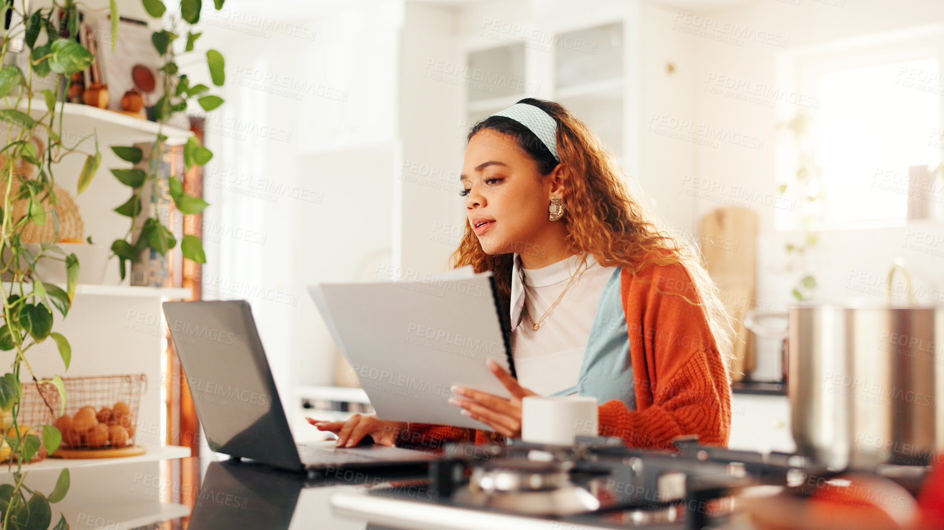 Buy stock photo Documents, laptop and remote work with woman in kitchen of home for planning or research. Computer, paperwork and reading with freelance employee at counter in apartment for small business startup
