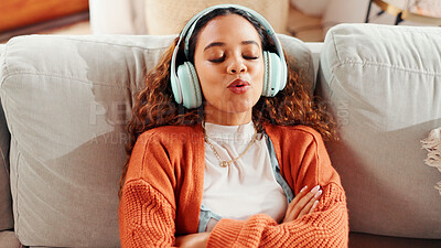 Buy stock photo Singing, sofa and woman listening with headphones, streaming music playlist and radio sound to relax. Audio tech, popular song and person resting with karaoke in home, track and album on weekend