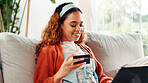 Credit card, laptop and smile with student on sofa for online shopping, ecommerce and loan. Digital payment, banking website and woman in living room of home for fintech, transaction or subscription