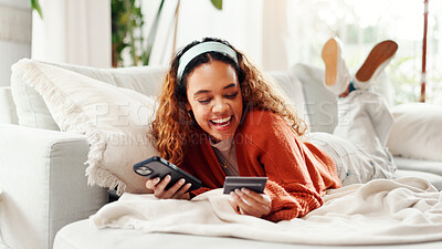 Buy stock photo Credit card, phone and excited with woman on couch for online shopping, ecommerce and sale. Digital payment, banking website and person in living room of home for deal, transaction or subscription