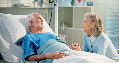 Buy stock photo Healthcare, senior couple and holding hands by hospital bed for healing, surgery recovery and smile. Elderly man, woman and support in clinic, love and hope for medical rehabilitation with wellness