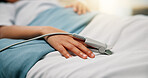 Hands, child and oximeter in hospital bed to monitor pulse, blood pressure and surgery recovery. Closeup, kid and medical device to track oxygen, chronic condition and post operation of critical care