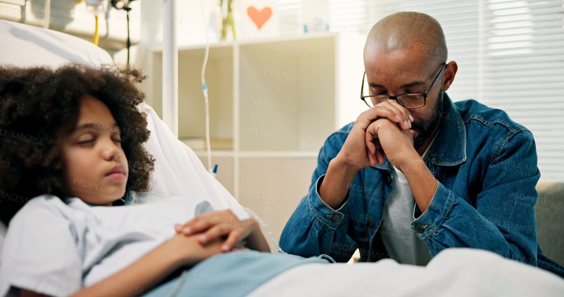 Buy stock photo Dad, boy and praying in hospital bed, faith and recovery with rehabilitation at pediatric wellness center. African father, child and prayer with hope, concern and support for healing at clinic