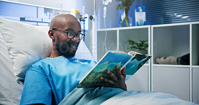 Buy stock photo Medical, relax and black man in hospital with book, fiction or reading hobby in post operation. Healthcare, rest or patient in clinic with literature, novel enjoyment or education in surgery recovery