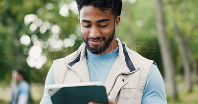 Buy stock photo Smile, tablet and volunteer with man in park for charity, community outreach or food drive. App, planning and research with happy person outdoor for activism, ngo donation or non profit update