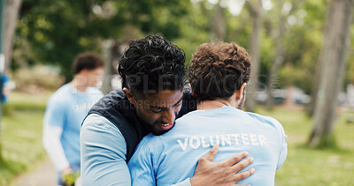 Buy stock photo Happy man, hug or volunteer with support for community service or commitment together in park. Male person, team or NGO with smile, trust or embrace for global outreach, charity or donation in nature