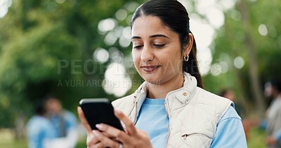 Buy stock photo Phone, woman and volunteer in nature for networking, contact or social media post for outreach. Happy, outdoor and female ngo worker with cellphone for communication with community service in park.