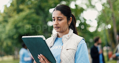 Buy stock photo Tablet, woman and volunteer in nature for charity, ngo or community service event at park. Technology, checklist and female non profit worker with planning, online or donation outreach outdoor.