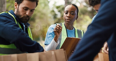 Buy stock photo Clipboard, volunteer and counting with woman in park for donation, community service and ngo project. Nonprofit checklist, grocery distribution and food drive with person outdoor for outreach program