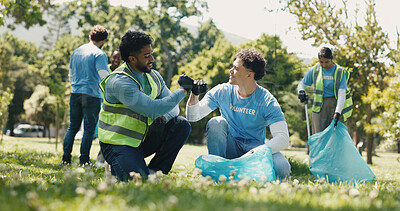 Buy stock photo Fist bump, volunteering and men in park, cleaning and NGO charity with collaboration. Outdoor, friends and people with trash bag, gesture or motivation with eco friendly campaign or community support