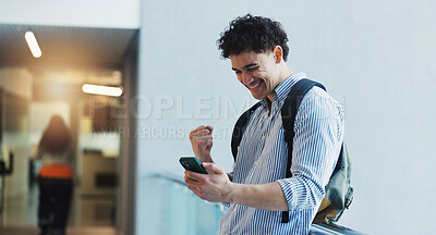 Buy stock photo Education, fist pump and phone with student man in university hallway as scholarship winner. App, celebration and success with happy learner on college campus for good news of school bursary award